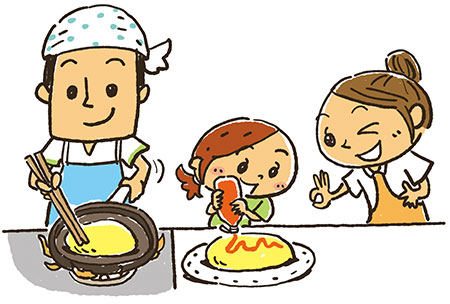 料理をしている親のそばで、楽しそうにお手伝いをしている子供